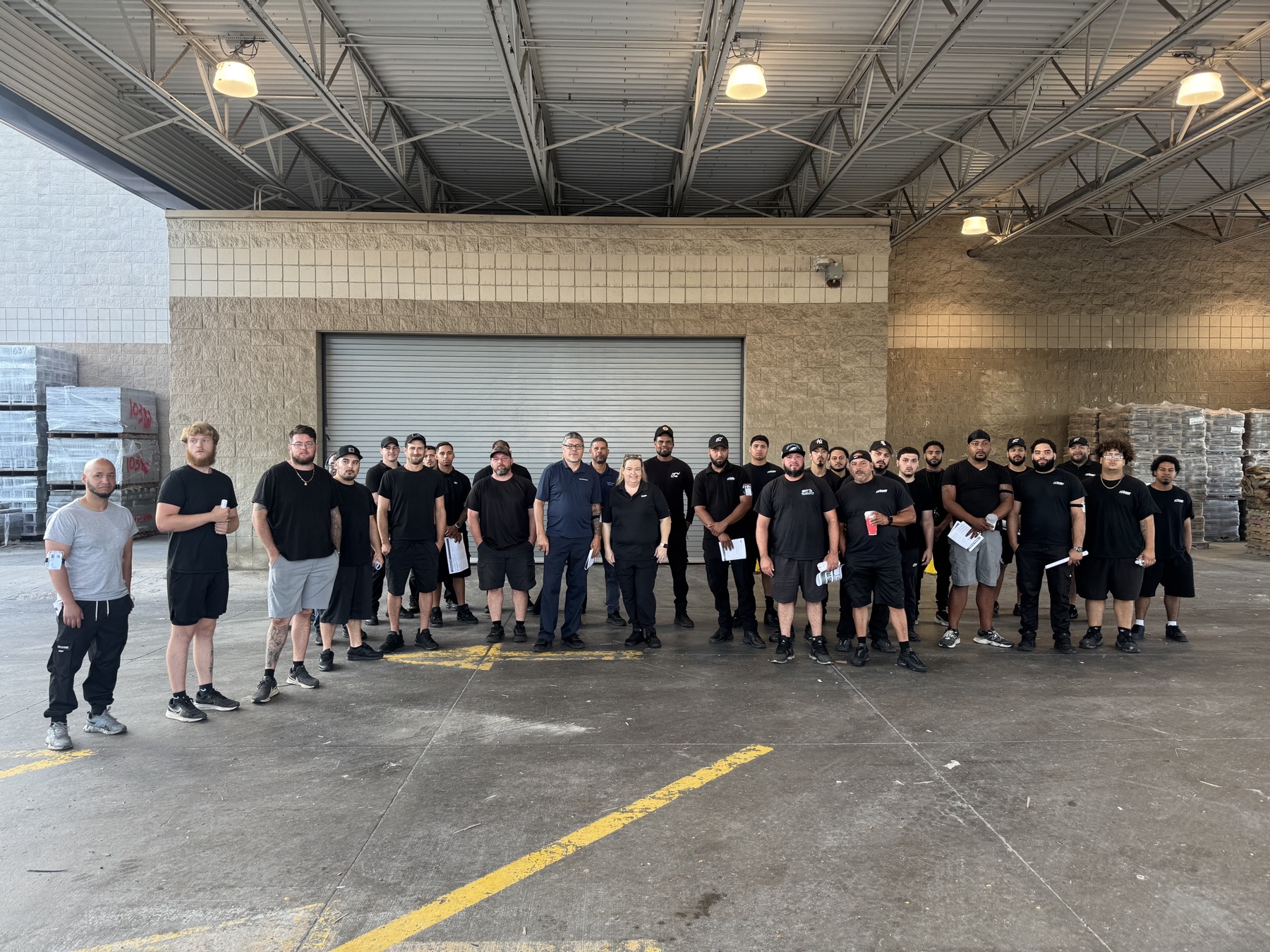 Group gathered on the warehouse floor